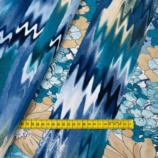 Stof Jersey ITY blauw glad bloemen tricot 0,5m